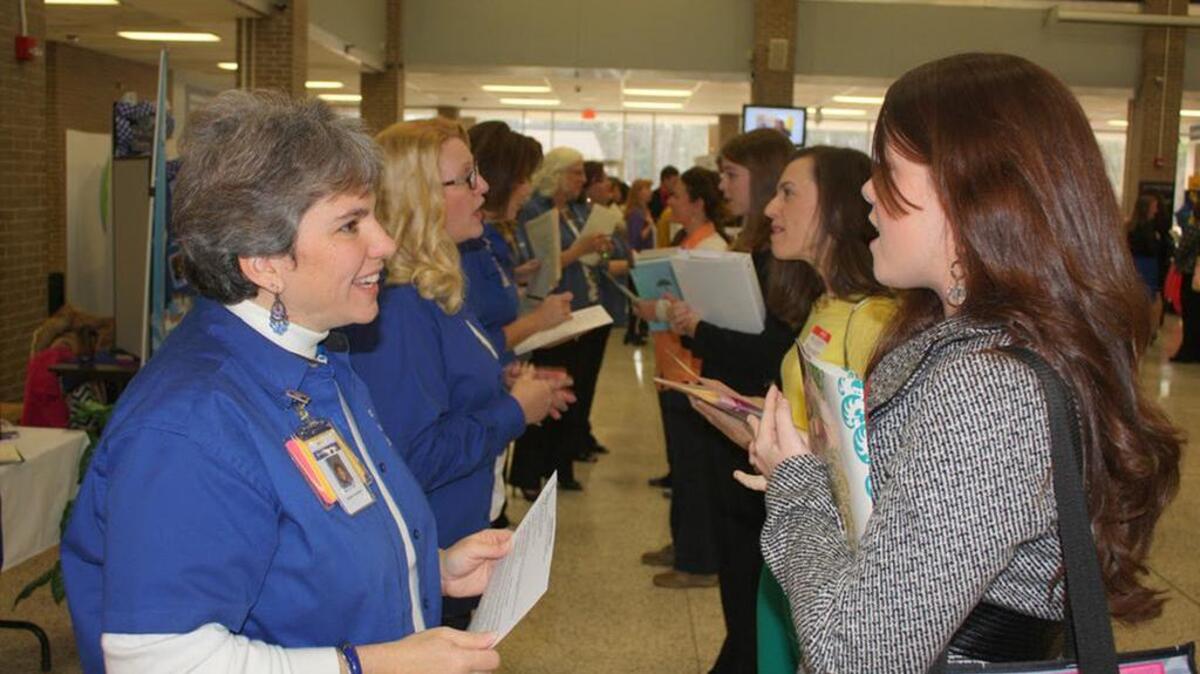 Prospective teachers talk with Lexington-Richland 5 representives at the district’s teacher recruitment fair.