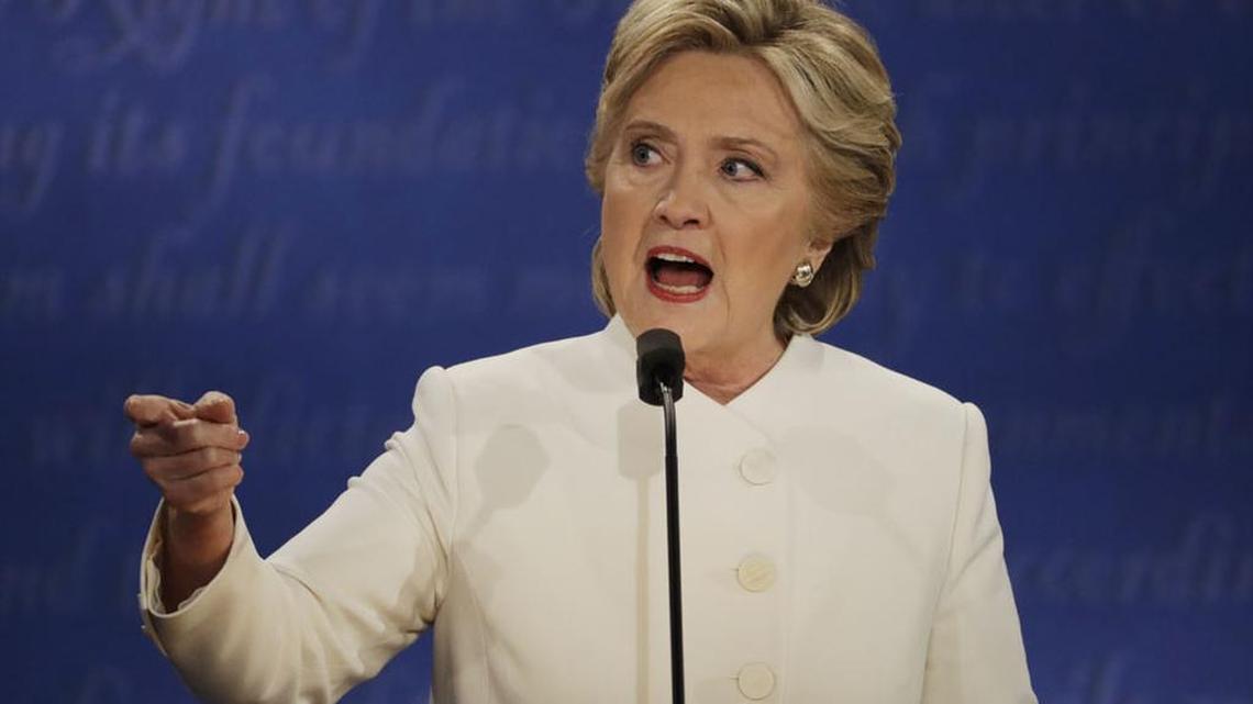 Democratic presidential nominee Hillary Clinton speaks to Republican presidential nominee Donald Trump during their final debate on Wednesday.