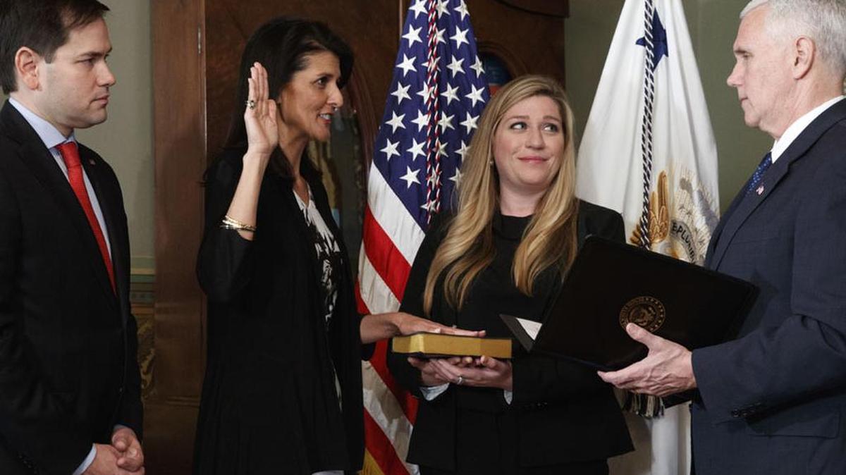 Sen Marco Rubio watches as Vice President Mike Pence administers the oath of office to US Ambassador to the UN, former SC Gov Nikki Haley. Holding the bible is Haley staffer Rebecca Schimsa.