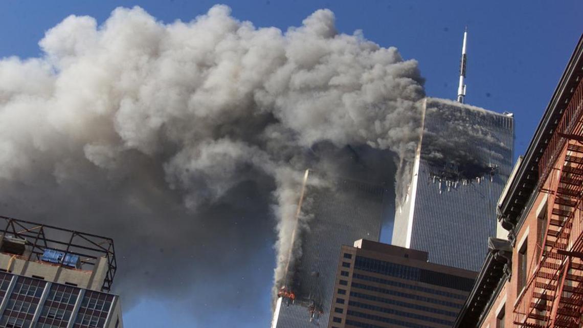 In this Sept. 11, 2001, file photo, smoke rising from the burning twin towers of the World Trade Center after hijacked planes crashed into the towers, in New York. Should Saudis be held responsible if they supported the terrorists?
