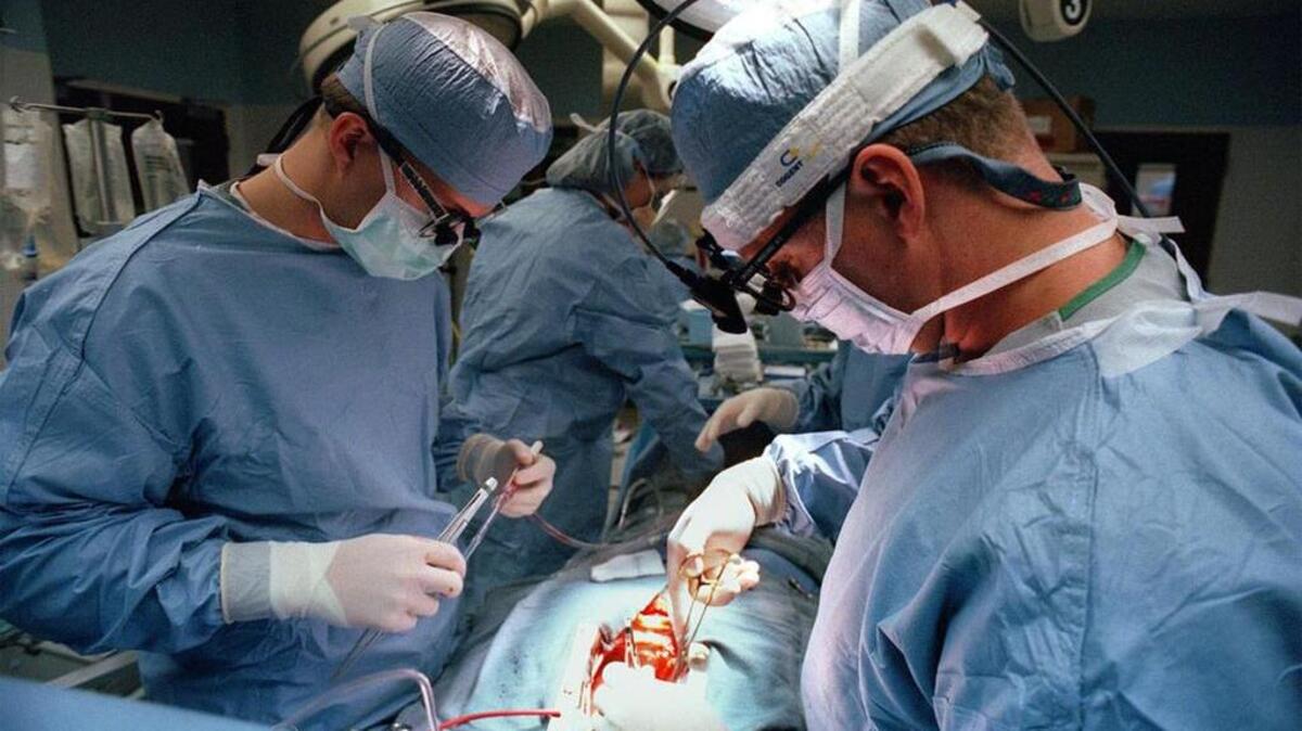 
Dr. Timothy Pansegrau performs heart surgery with the the help of Wayne Durbin at Palmetto Richland Memorial Hospital.
