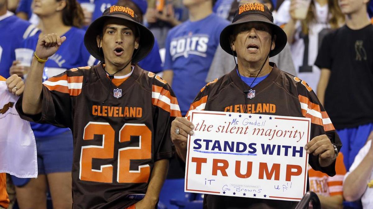 Cleveland Browns fans hold a sign following the national anthem before Sunday’s NFL football game between the Indianapolis Colts and the Browns.
