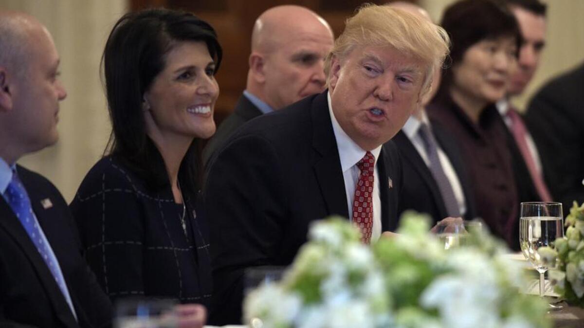 President Donald Trump, sitting next to U.S. Ambassador to the UN Nikki Haley, speaks during an April lunch with ambassadors of countries on the United Nations Security Council.