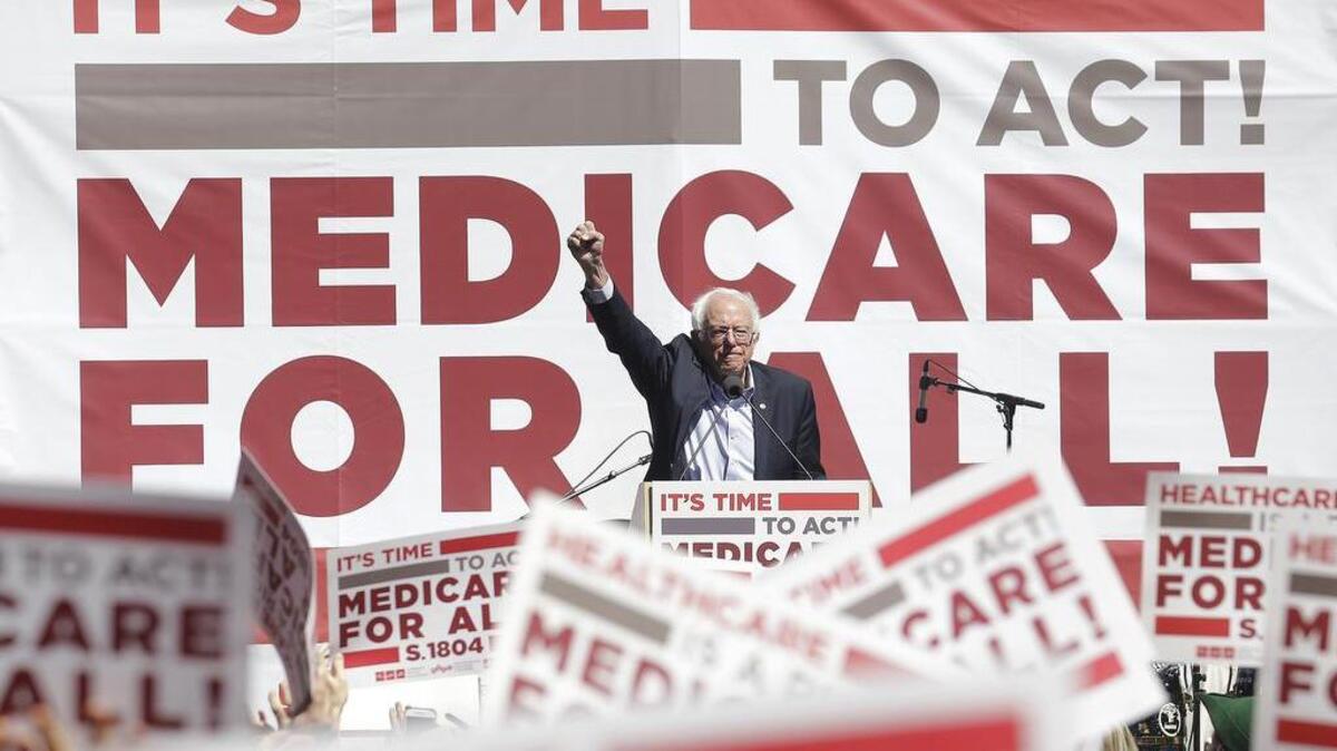 Sen Bernie Sanders waves after speaking at a health-care rally in September.