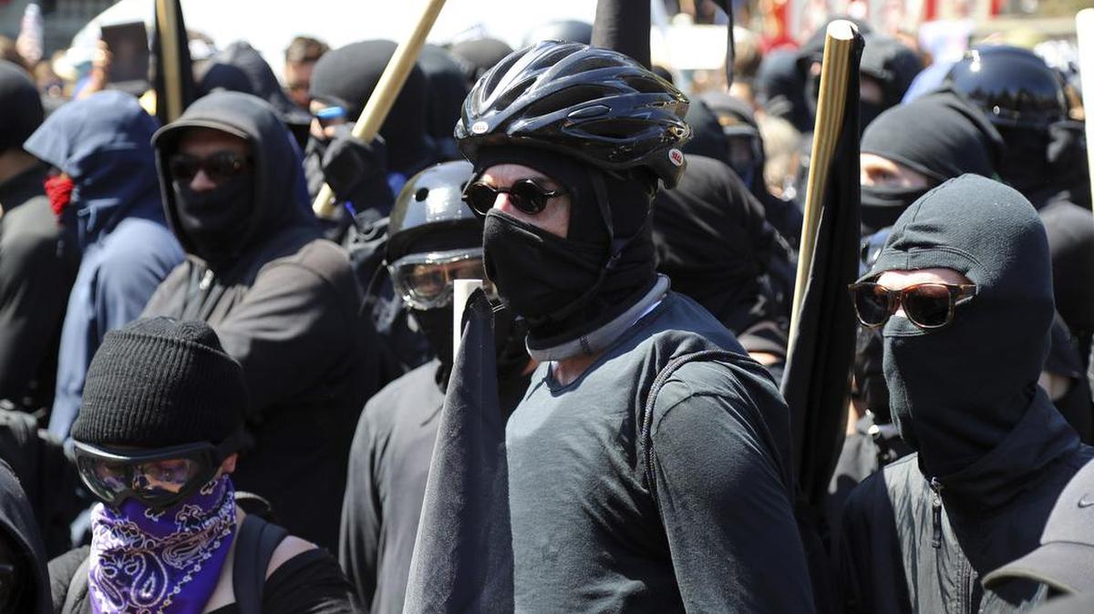 Antifa protesters, dressed in black, demonstrate during a Stand Against Hate rally in Berkeley, Calif., on Aug. 27.