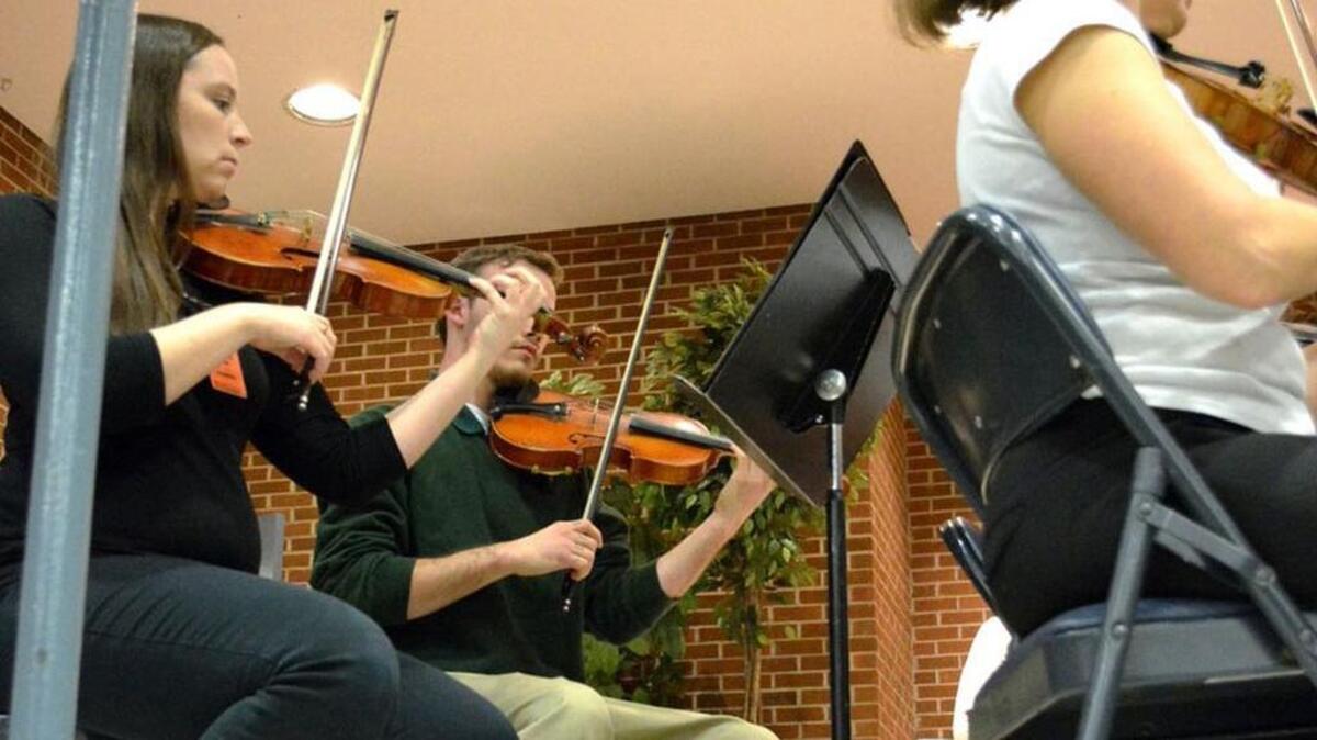 Jacob plays the violin with the SC Philharmonic during a recent concert at the Department of Juvenile Justice.