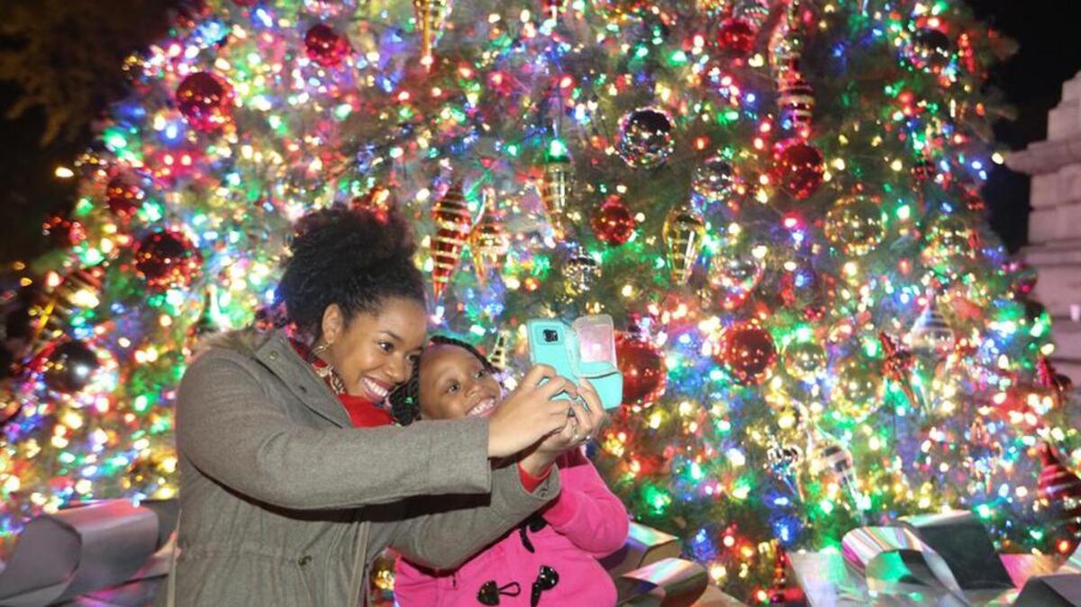 Tara Corbett-Craib takes a selfie with her daughter, Camryn Craib, 5, at the 50th Annual Governor’s Carolighting earlier this month. Ms. Corbett-Craib is continuing the tradition begun by her mother, who always brought her to the event.