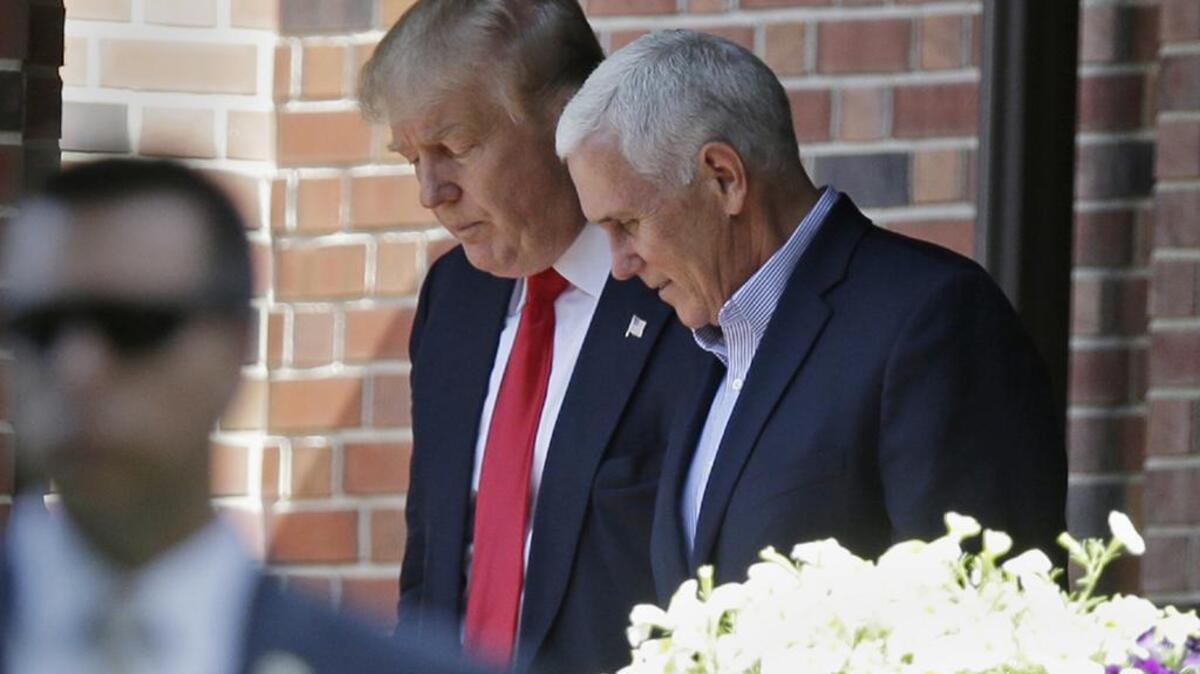 Donald Trump leaves the Indiana governor’s residence with Gov Mike Pence after their meeting on Wednesday.
