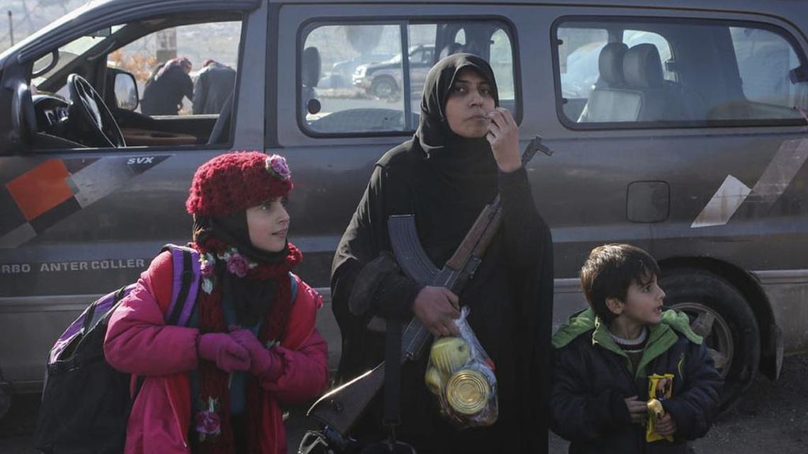 Syrians evacuated from the embattled Syrian city of Aleppo during the ceasefire arrive at a refugee camp near Idlib, Syria, on Tuesday. Russian Foreign Minister Sergey Lavrov said on Tuesday that Russia, Iran and Turkey are ready to act as guarantors in a peace deal between the Syrian government and the opposition.
