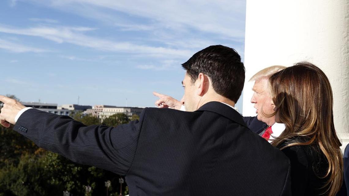 House Speaker Paul Ryan shows President-elect Donald Trump and his wife, Melania, the view from the speaker’s balcony of the inaugural stand that is under construction.