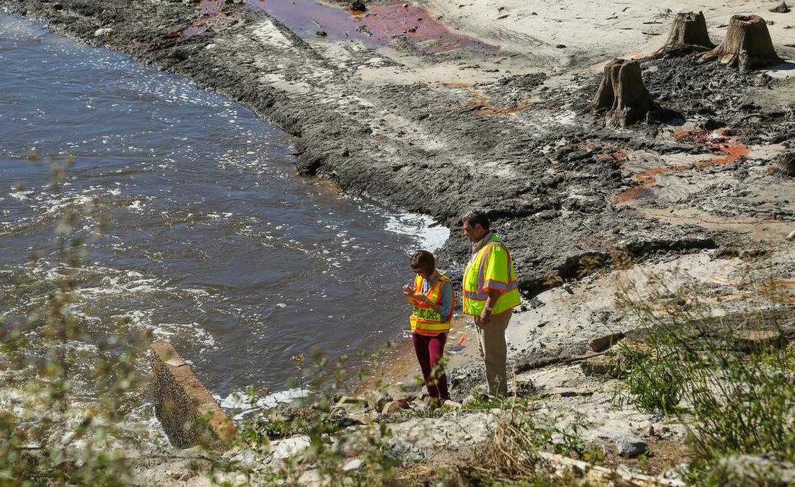 The Pine Tree Lake dam was one of several dams in the Gills Creek watershed that breached in a historic 2015 flood. Here, state inspectors examine the remains of the dam. It was not rebuilt.