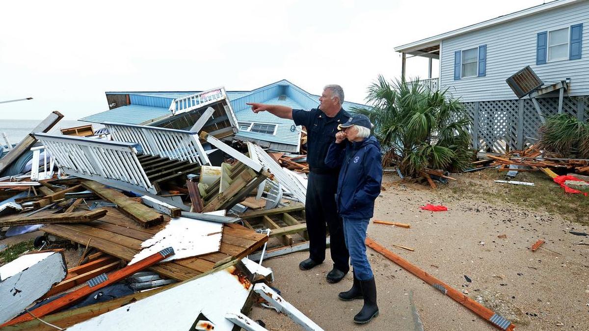 Edisto Beach Chief George Brothers and Mayor Jane Darby survey the damage Hurricane Matthew did to homes along Palmetto Boulevard last fall.