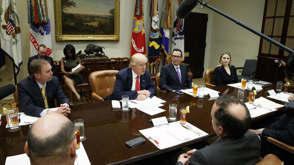 Budget Director Mick Mulvaney, left, attends a February White House meeting on the budget with President Donald Trump and Treasury Secretary Steve Mnuchin.