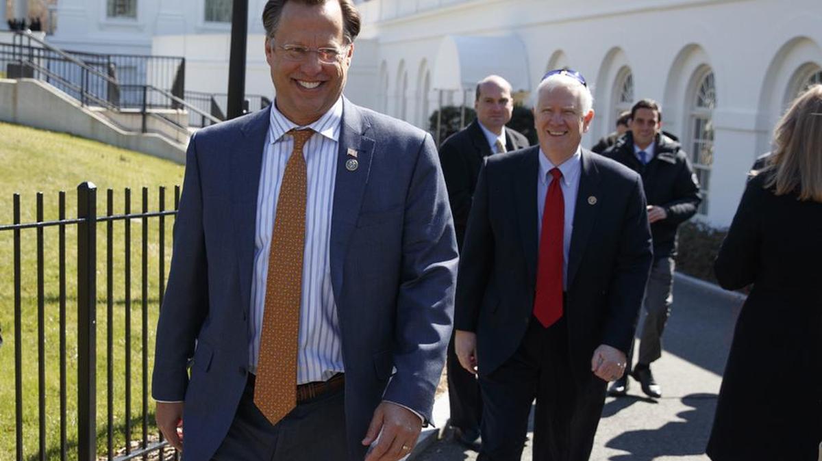House Freedom Caucus member Rep. Dave Brat, R-Va., and other members arrive Thursday at teh White House.