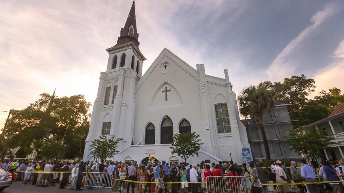 People flocked to Emanuel AME Church to pay their respects after nine members of the congregation were killed by a racist gunman,