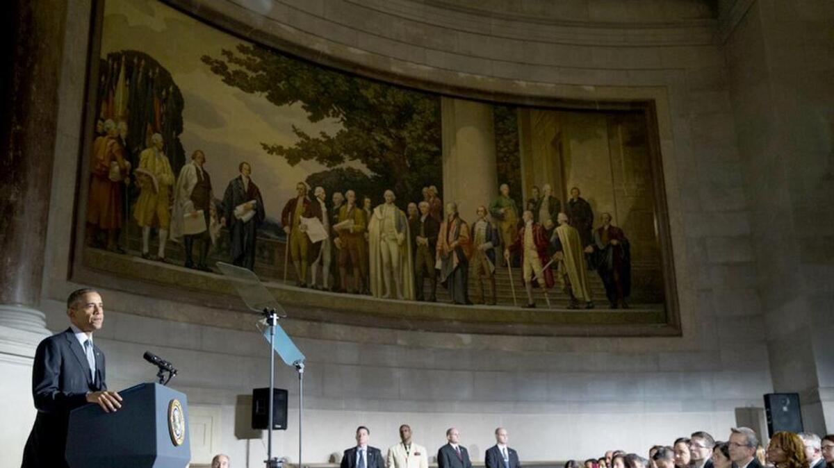 President Barack Obama speaks during a naturalization ceremony at the National Archives in Washington.