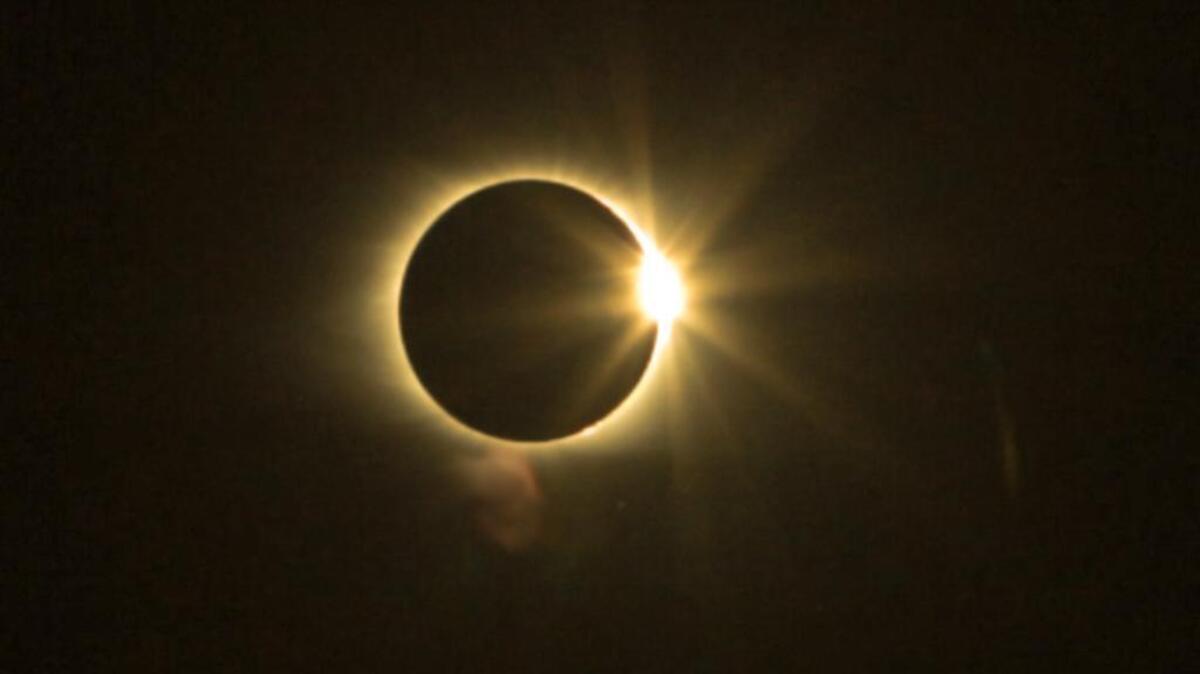 The sun peaks out from the moon after the moment of totality during the solar eclipse as viewed from Columbia.