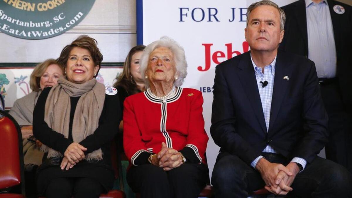 Jeb Bush sits with his mother, former first lady Barbara, and wife, Columba, during a campaign stop in Spartanburg on Friday.
