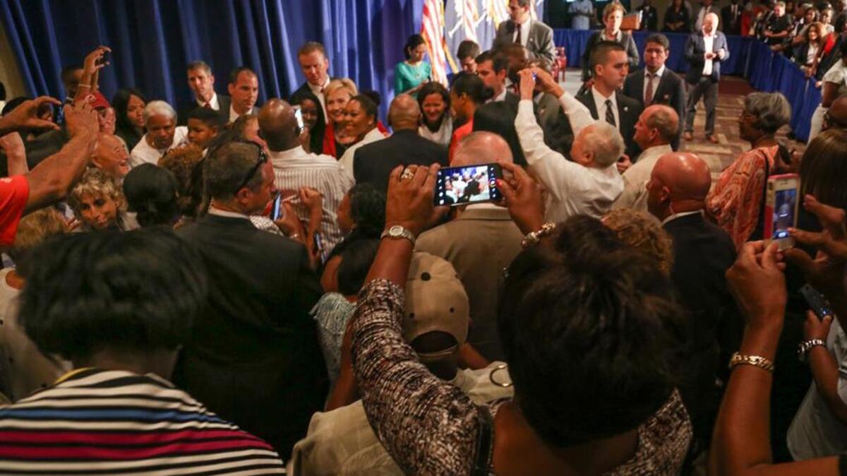 People swarm to get a photo of Hillary Clinton after she spoke at Brookland Baptist Church in West Columbia.