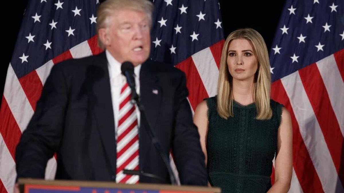 Ivanka Trump looks on as her father, Republican presidential candidate Donald Trump, delivers a policy speech on child care.