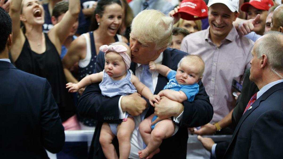 Republican presidential candidate Donald Trump likes babies. Really. As long as they’re quiet and compliant, like these he encountered in Colorado Springs, Colo., on Friday.