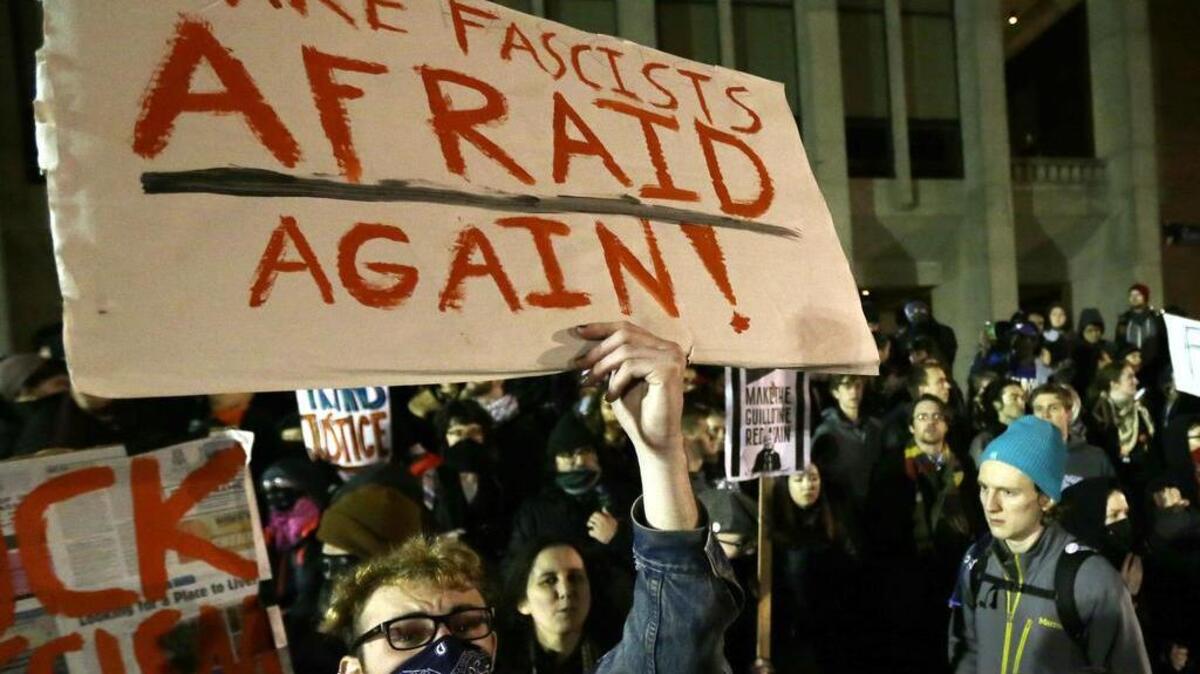 A protester holds a sign that reads “Make Fascists Afraid Again!” during a demonstration in January on the University of Washington campus where far-right commentator Milo Yiannopoulos was giving a speech.