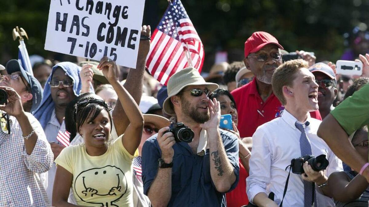 
Spectators cheer as an honor guard from removes the Confederate battle flag from the SC State House grounds.
