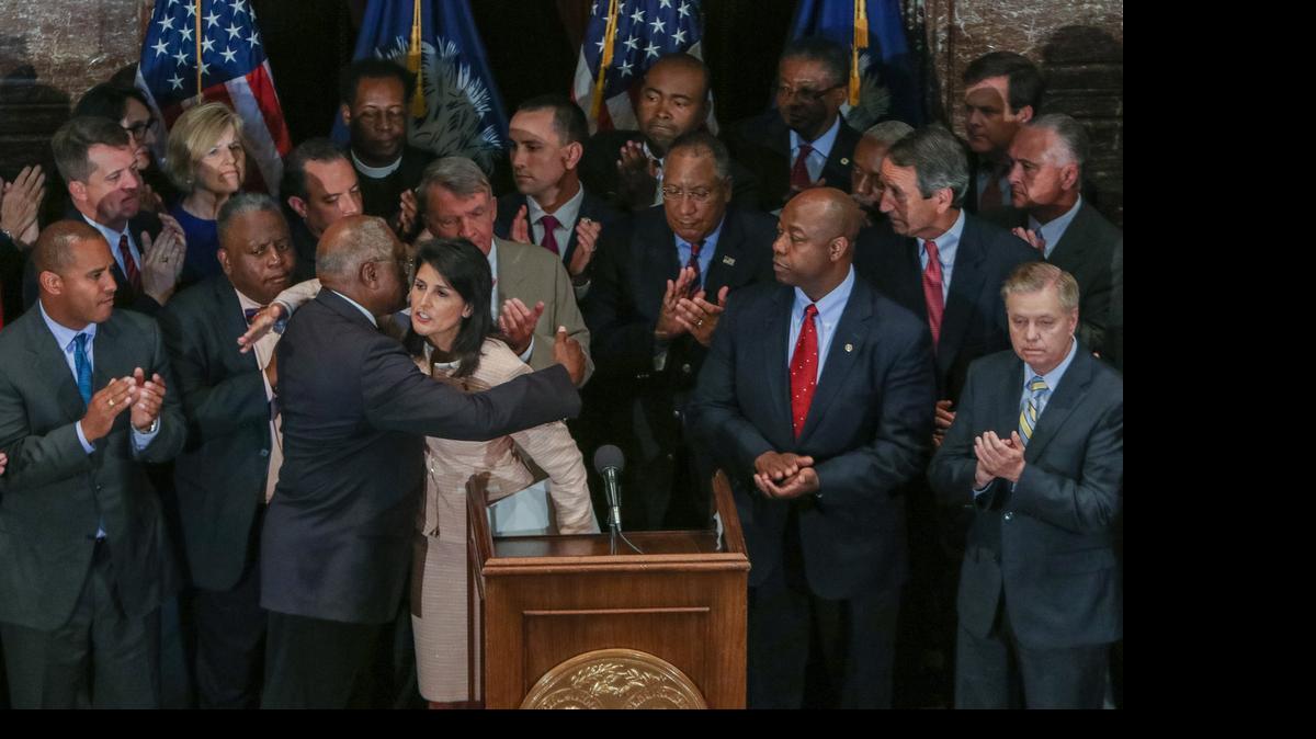 
SC Gov Nikki Haley hugs U.S. Congressman James Clyburn after she called for legislators to remove the Confederate flag from the grounds of the State House. On Tuesday, the Senate voted 36-3 to do that.
