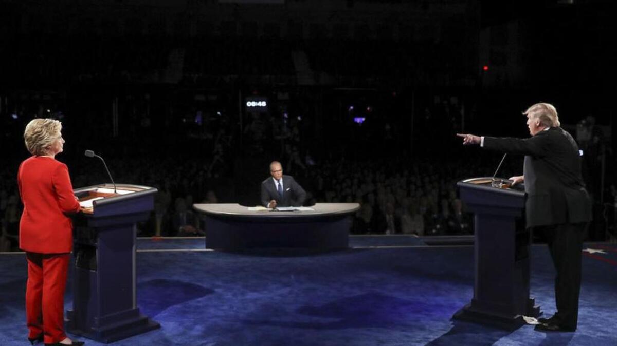 Republican Donald Trump points toward Democrat Hillary Clinton during Monday’s presidential debate.