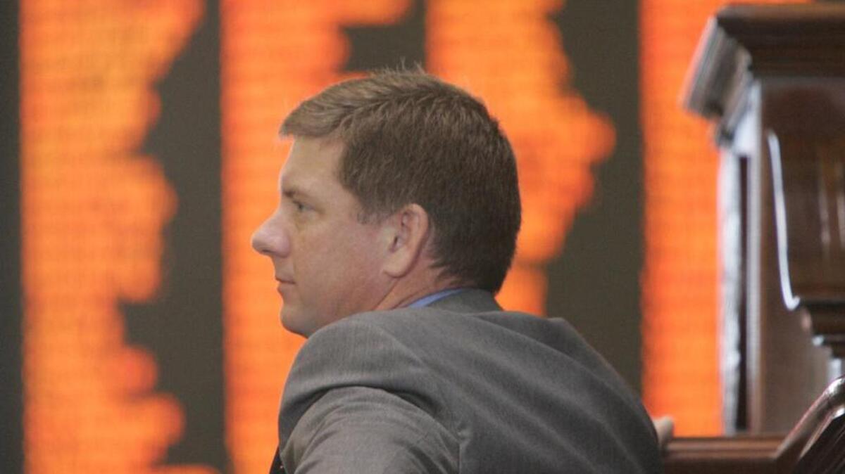 SC Rep Jim Merrill watches debate on a 2006 property tax proposal he is now charged with being paid to help promote.