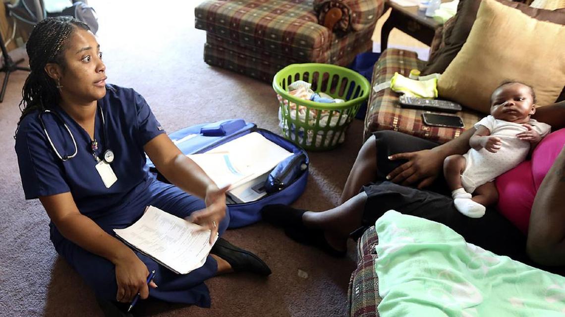Horry County nurse Felecia Richardson watches Jayden Isaiah during a home visit used to educate the mother and offer assistance as part of a nurse-family partnership through the health department.