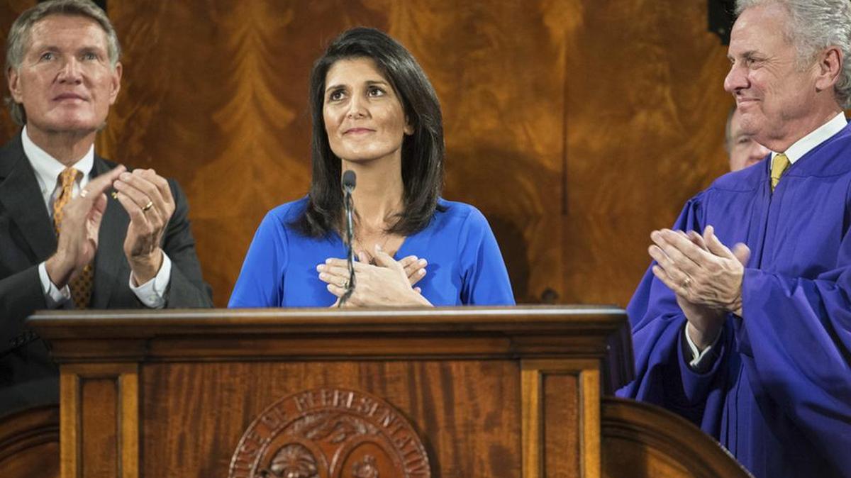 SC Gov Nikki Haley, with Sen.Harvey Peeler and Lt Gov. Henry McMaster, gestures to the balcony while delivering her State of the State address on Wednesday.