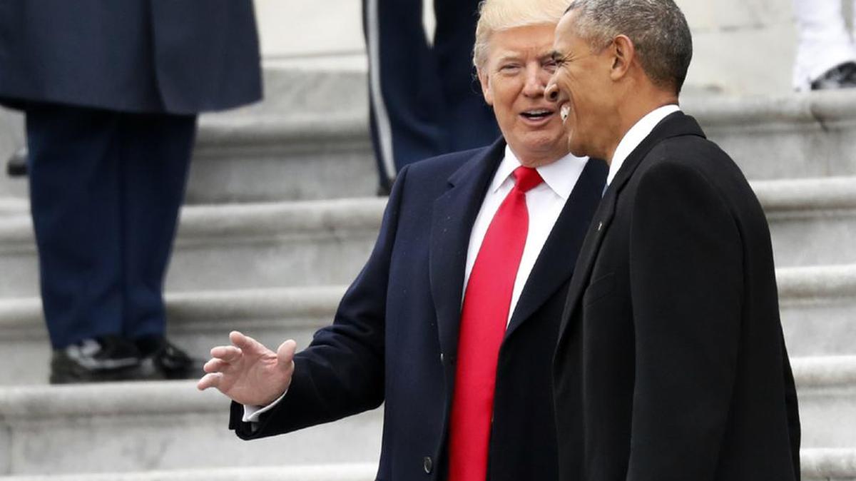President Donald Trump and former President Barack Obama pause on the steps of the US Capitol as the Obamas depart after the inauguration.