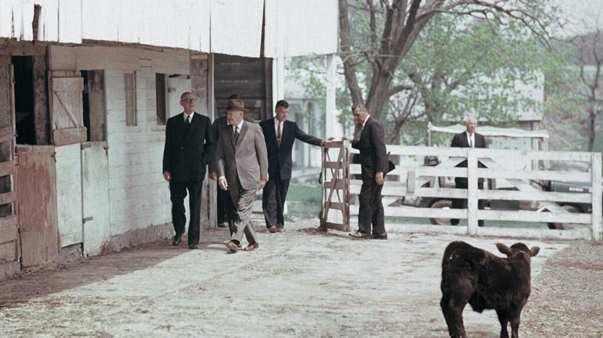 This April 24, 1960, photo shows President Dwight Eisenhower, wearing hat, hosting French President Charles de Gaulle at his farm in Gettysburg, Pa.
