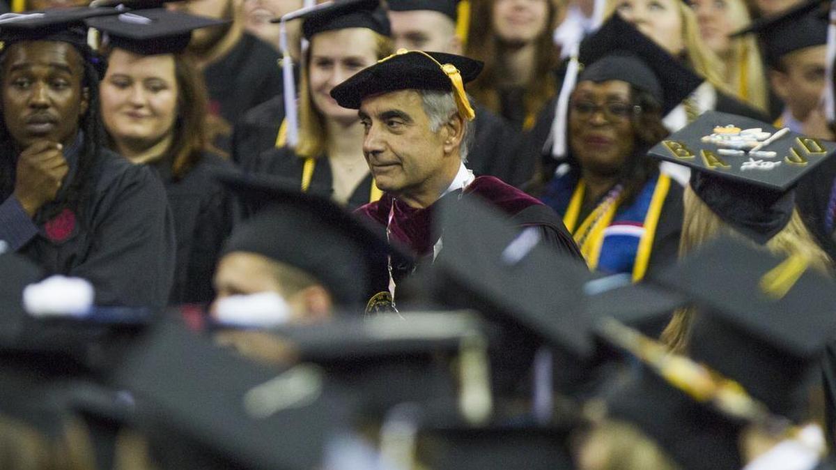 USC president Harris Pastides walks between students during USC’s graduation ceremony in May.