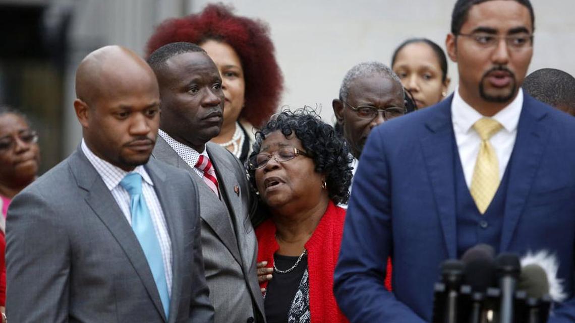 Walter Scott’s family and supporters urged calm after a jury failed to reach a verdict in the trial of former police officer Michael Slager. Here Judy Scott, center, Walter Scott’s mother, is comforted by her son, Rodney Scott, as attorneys Chris Stewart, left, and Justin Bamberg discuss the mistrial.