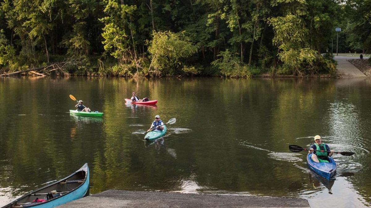 Kayakers land their boats at Hopes Ferry Landing at Saluda Shoals Park last month before they learned that DHEC had issued a warning against swimming in that part of the Saluda because poorly treated sewage was draining into the river.