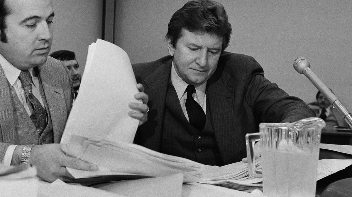 In this 1980 photo, then-Rep John Jenrette goes over paperwork with his attorney Kenneth Robinson before one of a series of House Ethics committee hearings.