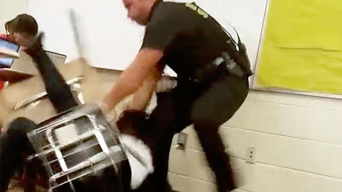 A photo from the Oct 26 video shows then-Richland County Sheriff’s Deputy Ben Fields removing a student from her desk at Spring Valley High School. after she refused to hand over her cell phone or leave the class.