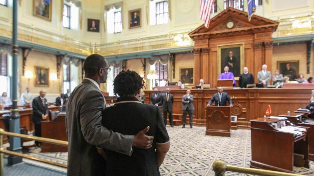 
The Rev. Kylon Middleton supports Jennifer Pinckney, the widow of Sen. Clementa Pinckney, as Sen. Gerald Malloy welcomes her to the SC Senate last month after the upper chamber made quick work of passing legislation to remove the Confederate flag from the State House grounds.
