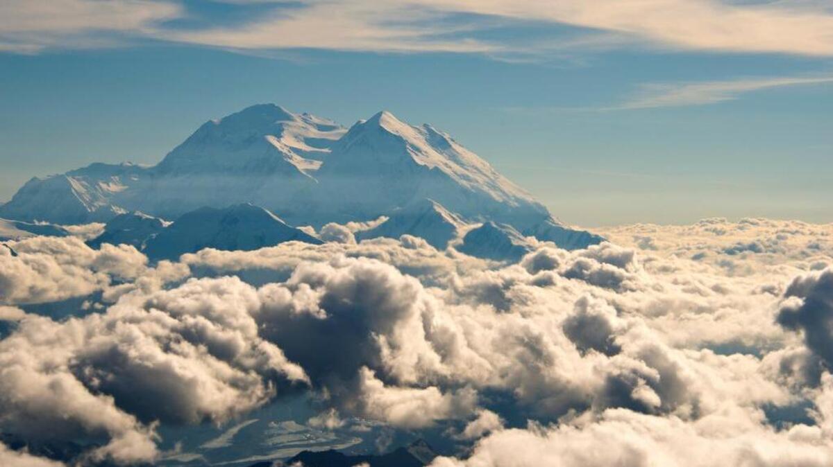 
In this Monday, Aug. 3, 2015, aerial photo provided by Holland America Line, Mount McKinley pierces through the clouds above Denali National Park and Preserve in Alaska. 
