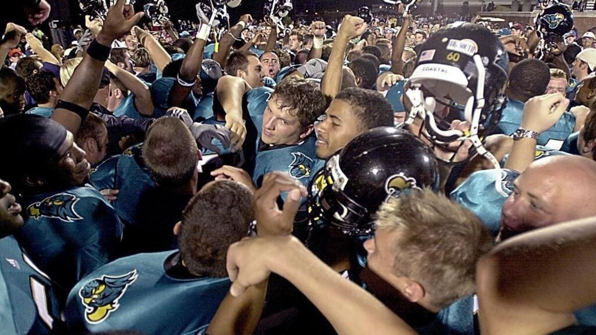 
Coastal Carolina football players celebrate winning the first game in school history as they defeated Newberry in 2003. The school announced Tuesday the team will join the FBS Sun Belt Conference.
