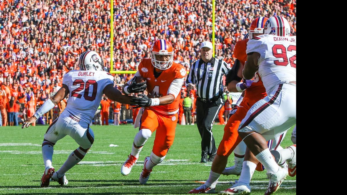 
Clemson quarterback Deshaun Watson (4) shakes off the tackle of South Carolina safety T.J. Gurley (20) during November’s game.
