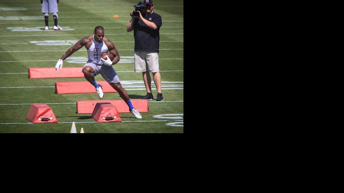 
Mike Davis works out for NFL scouts during USC Pro Day on Wednesday at Williams-Brice Stadium. 

