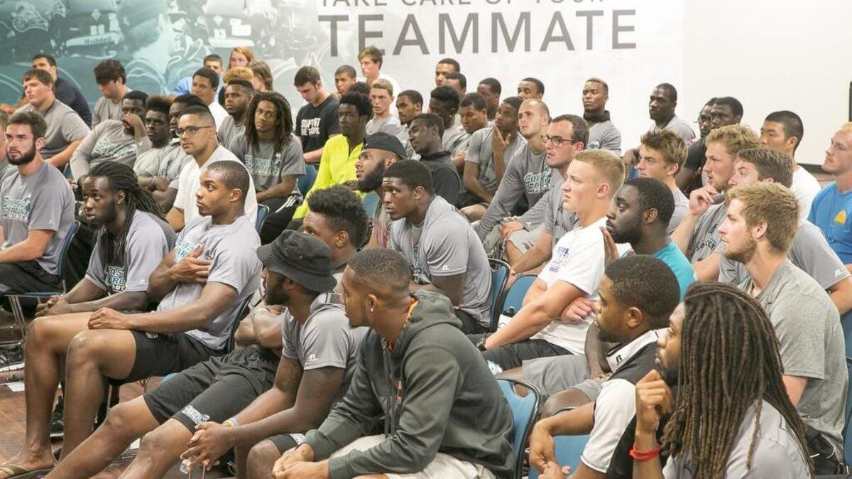 
Catherine Hoke of Defy Ventures gives a motivational talk to members of the Coastal Carolina football team. The guest visit is part of CCU coach Joe Moglia's weekly “Life After Football” series in which athletes are encouraged to develop life skills and to plan for their futures. 
