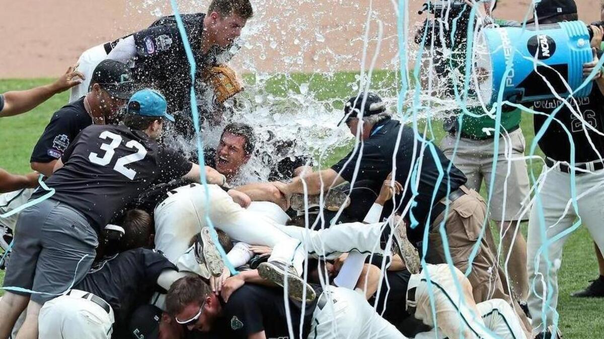 Coastal Carolina players celebrate after winning the championship against the Arizona Wildcats in game three of the College World Series championship series at TD Ameritrade Park.