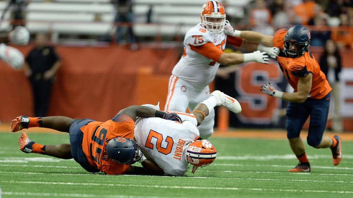 Clemson quarterback Kelly Bryant (2) is sacked by Syracuse defensive lineman Chris Slayton (95) during the first half their game Friday.