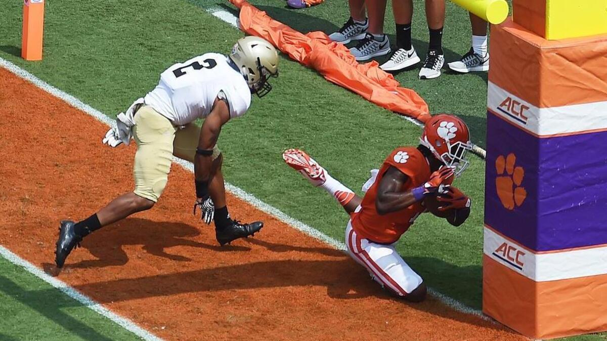 
Clemson receiver Mike Williams collides with the goal post after catching a 4-yard touchdown pass Saturday. Williams broke his neck on the play and will be out at least six weeks.

