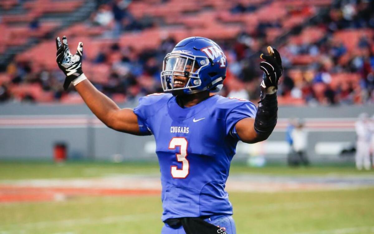Wake Forest's Devon Lawrence celebrates his touchdown pass on a trick play during the NCHSAA 4AA football championship game between Greensboro Page and Wake Forest.