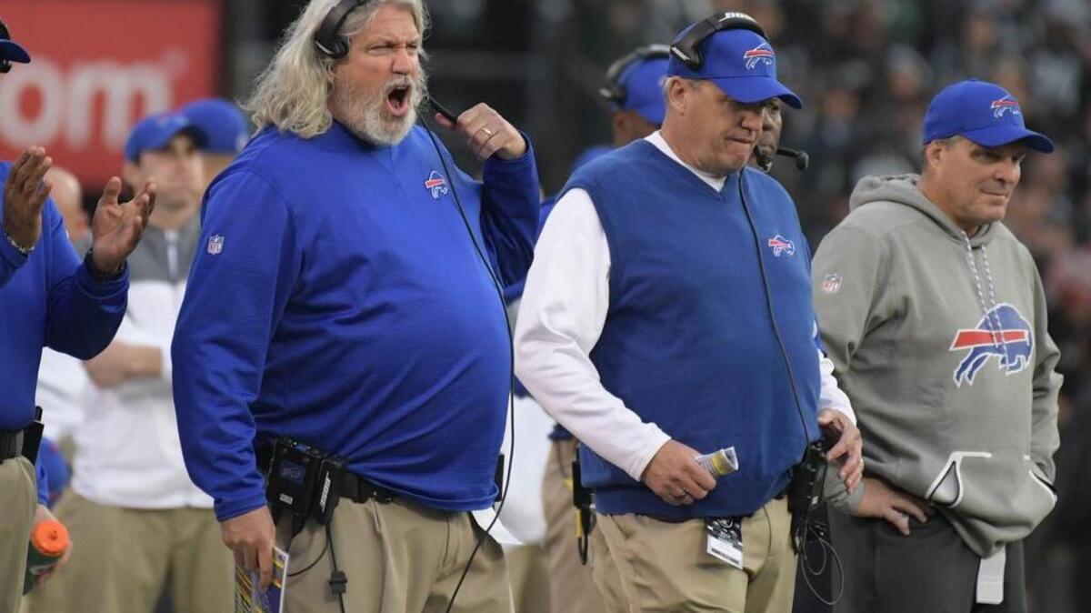 Former Buffalo Bills defensive coordinator Rob Ryan (left) and brother/head coach Rex Ryan react in the fourth quarter against the Oakland Raiders during a NFL football game at Oakland Coliseum.